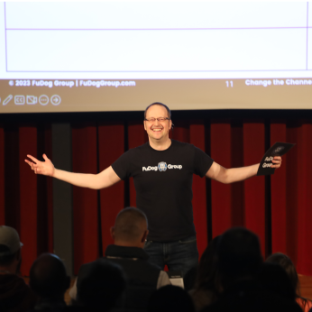 Aaron Hoos presenting on stage